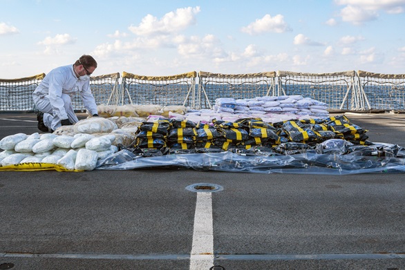 A sailor checks the impressive haul of drugs