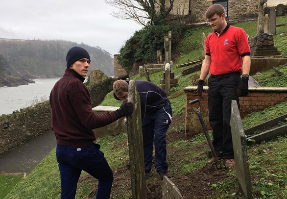 Budding naval aviators help to spruce up local church grounds