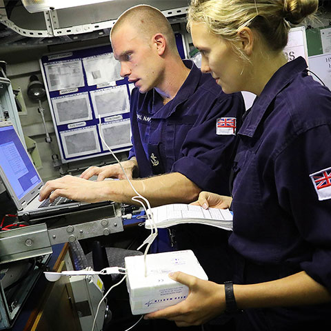 royal navy Hydrography and Meteorology Officer and specialist at work on board