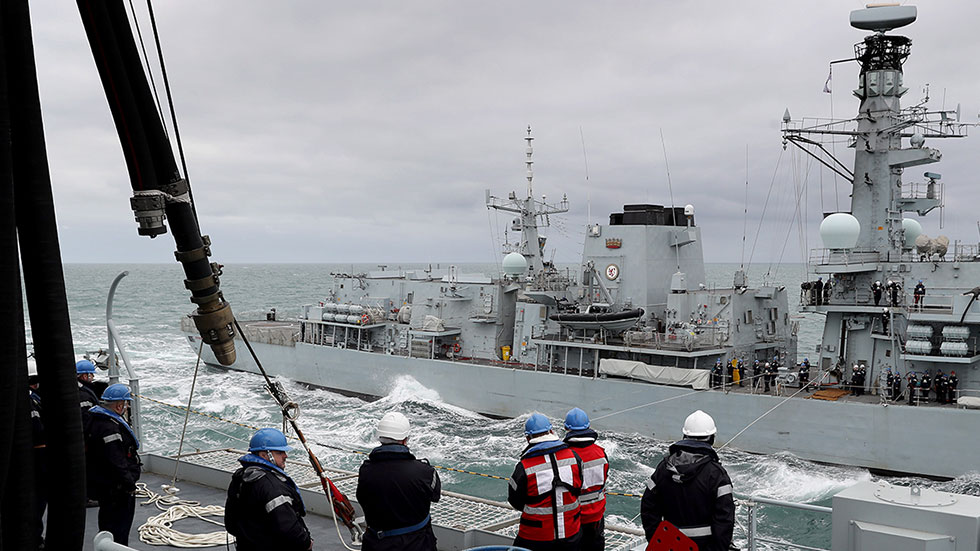 Royal Fleet Auxiliary personnel at work. 