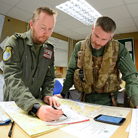 Two Pilots looking at a map