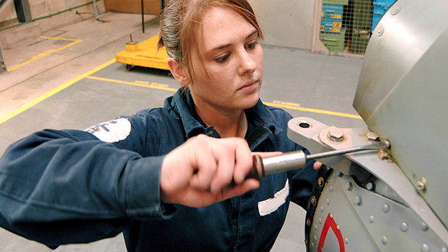 An Advanced Apprenticeship Air Engineering rating working on a Royal Navy aircraft.