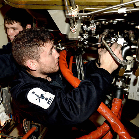 A Royal Navy Advanced Apprenticeship Marine Engineer at work