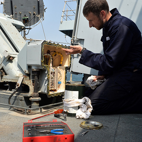 A Royal Navy Advanced Apprenticeship Weapon Engineer at work