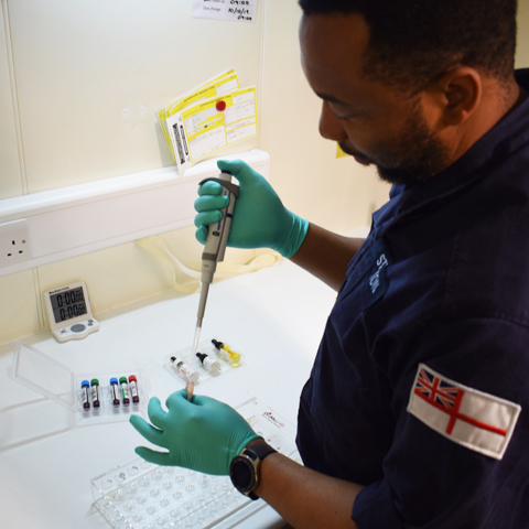 biomedical scientist carrying out testing procedure