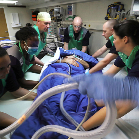 nursing and medic team providing assistance in theatre procedure