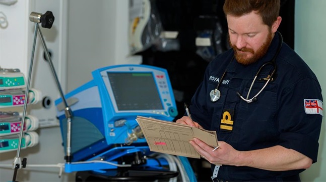 Nursing Officer writing out notes in a hospital