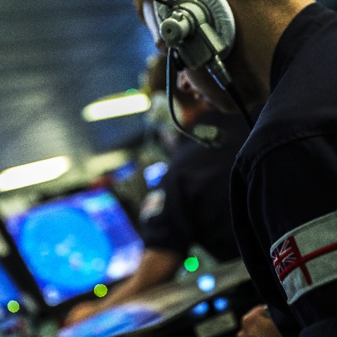 Members of the Ships Company man the Operations Room during a static non firing gunnery exercise