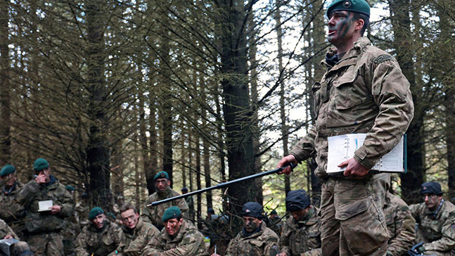 A Royal Marine Commando officer training Royal Marine Commandos.  