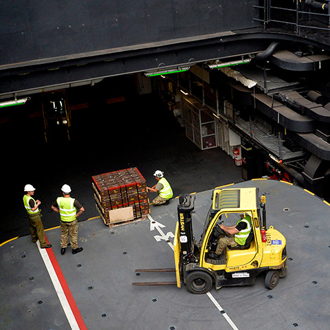 RFA personnel with a fork lift truck