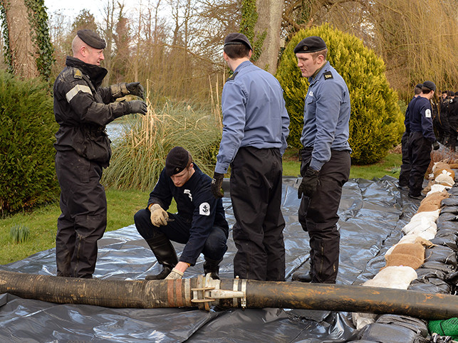 Royal Navy personnel providing relief from floods in Hampshire. 