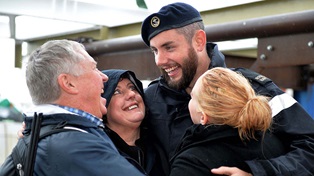 Returning Royal Navy personnel greeting their family. 