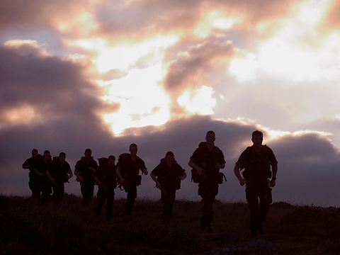 silhouette of troops