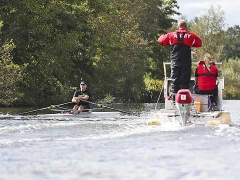 rower watched over by army official