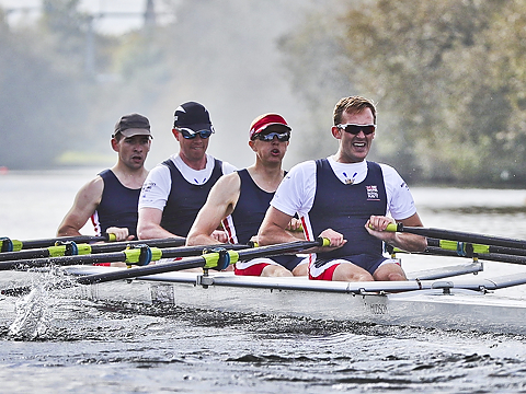 coxless four powering through water