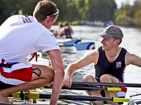 single sculler speaking with team mate