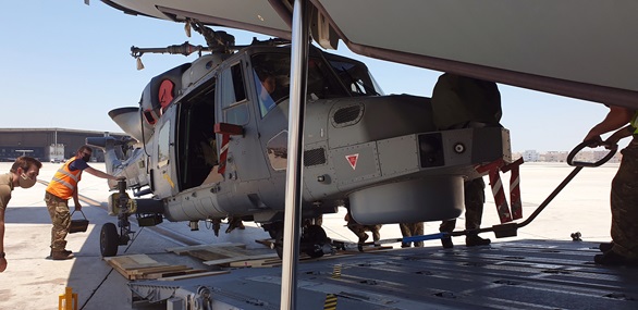 A Wildcat is wheeled out of an RAF C-17 transporter in Bahrain