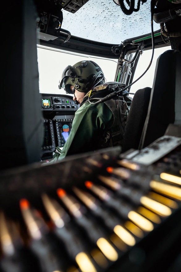 Pilot in Wildcat cockpit and ammo belt