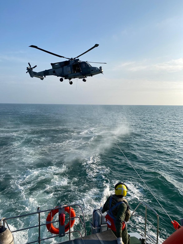 Aircrew aboard HMS Ranger prepare to winch with the Wildcat