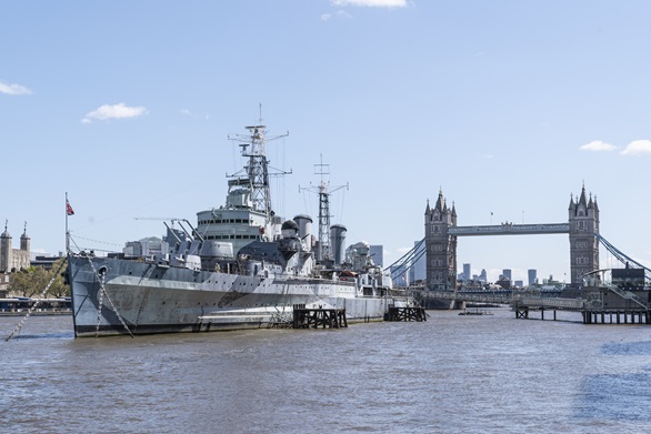 HMS Belfast at her berth on the Thames next to Tower Bridge