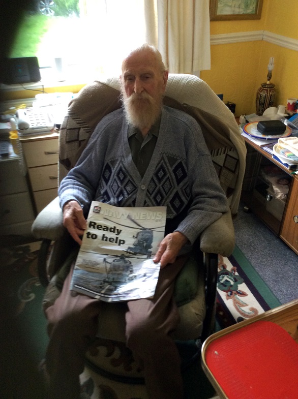 Cdre David Hughes with a copy of Navy News on his 106th birthday