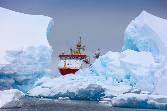 HMS Protector moves between giant icebergs off Antarctica