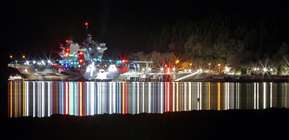 The magnificent sight of HMS Queen Elizabeth lit up at night at the refurbished Glenmallan Jetty on Loch Long