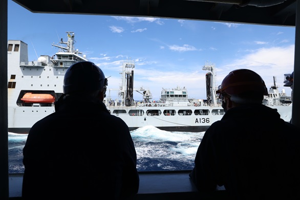 HMS Defender takes on fuel from RFA Tidespring to enable the ship to continue Exercise Pacific Crown.