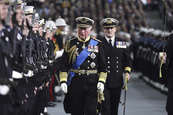 The King - here as Prince of Wales in 2019 inspects the Royal Guard - at the commissioning of HMS Prince of Wales