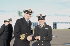 CPO Henry Gibson receiving the first clasp to his Volunteer Reserves Service Medal from Captain Nick Dorman