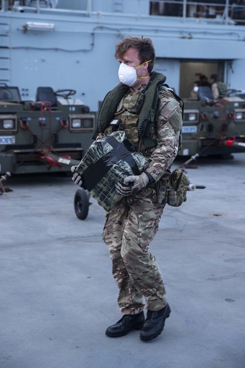 A Royal Marines Commando returns some of the seized drugs to RFA Argus