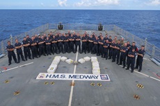 HMS Medway's crew with the drugs seized in their two counter-narcotics operations
