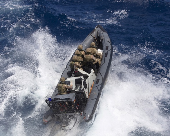 A specialist team from 47 Commando heads out in a RIB to intercept the drug runners' craft