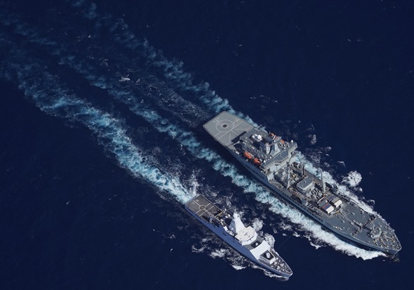 A top-down view of HNLMS Holland RASing with RFA Wave Knight