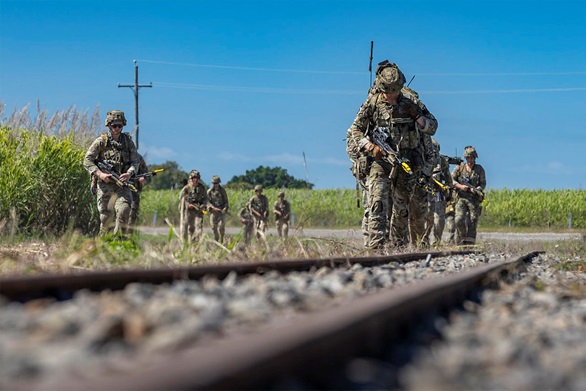 Bravo Company patrol the railway line on the outskirts of Ingham
