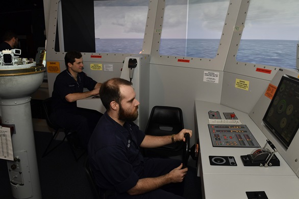 HMS Albion’s bridge team practising manoeuvres in the Britannia Royal Naval College bridge simulator.
