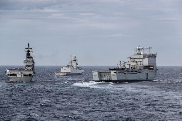 The Italian carrier ITS Giuseppe Garibaldi, frigate ITS Carlo Bergamini and RFA Lyme Bay manoeuvre in close formation
