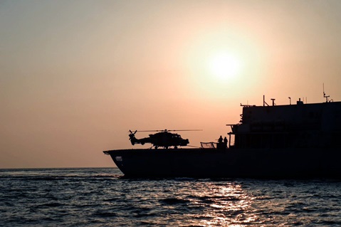 A Wildcat helicopter on Montrose's deck at sundown