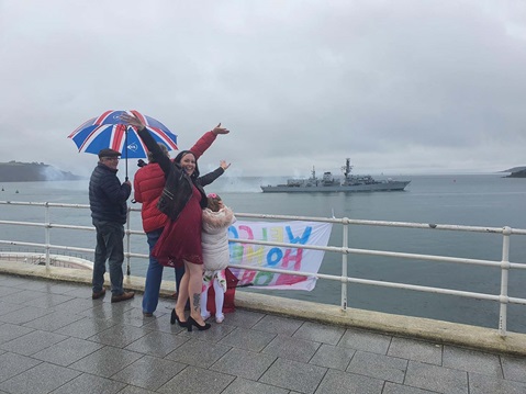 Families await the return of their loved ones from the shore as HMS Argyll returns home to Plymouth after six months in the Gulf