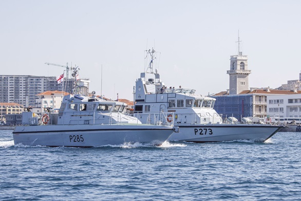 HMS Sabre (nearest the camera) and HMS Pursuer with the Tower, British Forces HQ Gibraltar, in the background