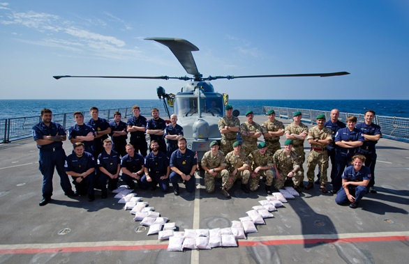 Dragons wildcat helicopter with the Royal Marines and Royal Navy sailors showing the £9 million drugs haul