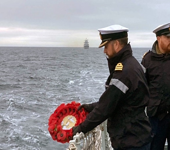 Commander Will Blackett prepares to lay a wreath in the Norwegian Sea