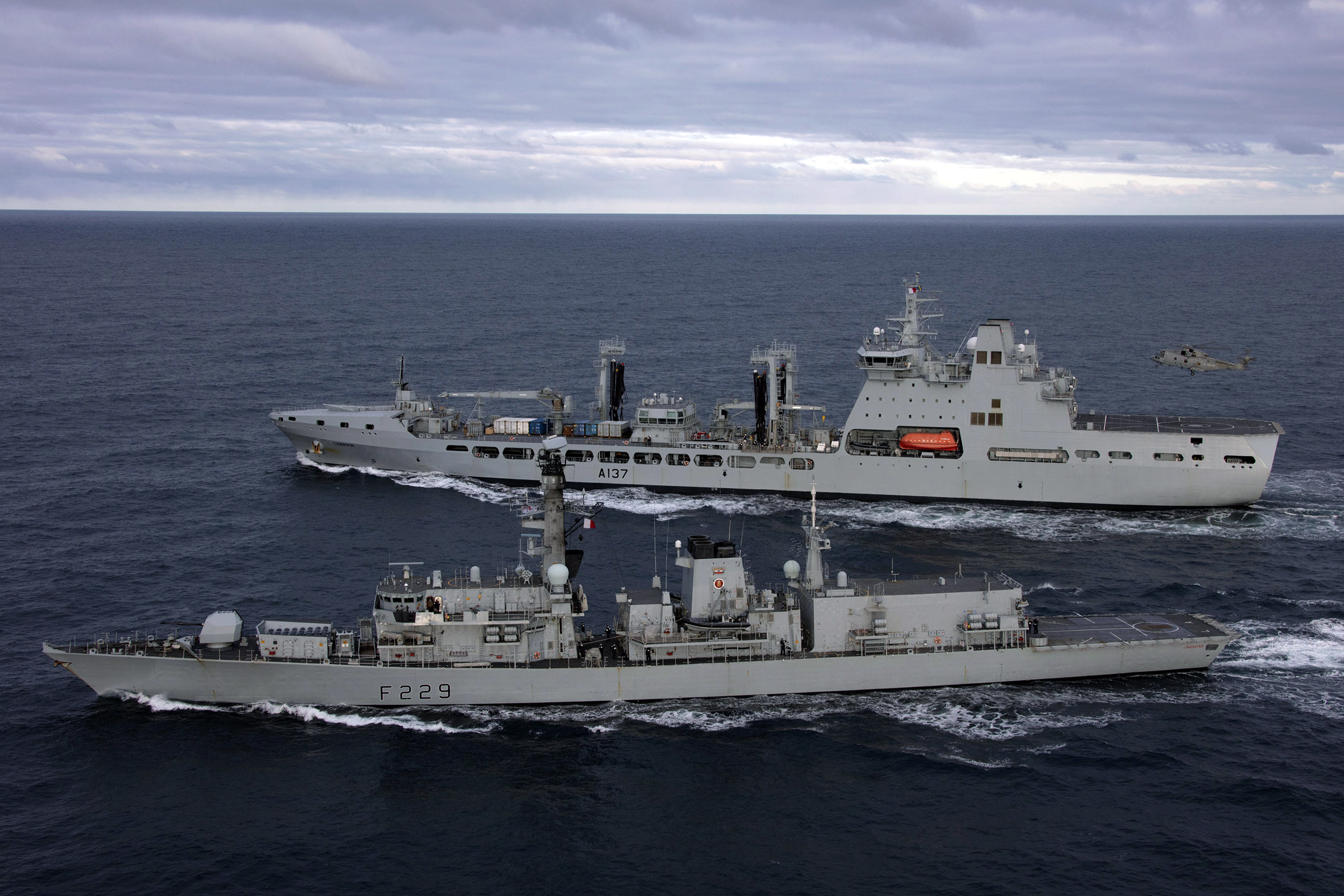 HMS Lancaster breaks away from tanker RFA Tiderace after refuelling