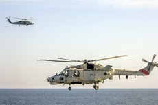 An Omani Super Lynx helicopter (foreground) and a US Navy Seahawk