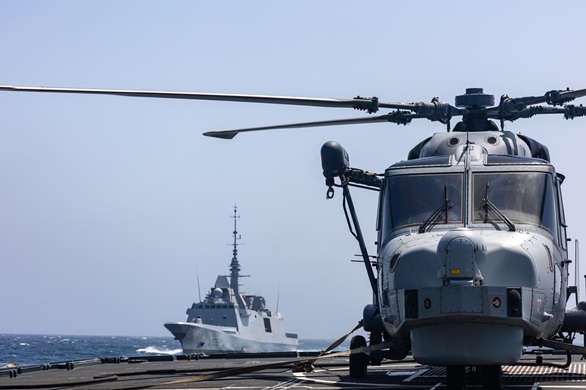 FS Languedoc approaches HMS Montrose with her Wildcat on deck
