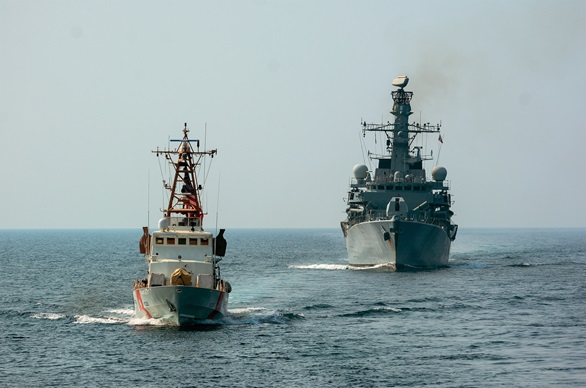 A USCG patrol boat leads HMS Montrose during a joint patrol.jpg