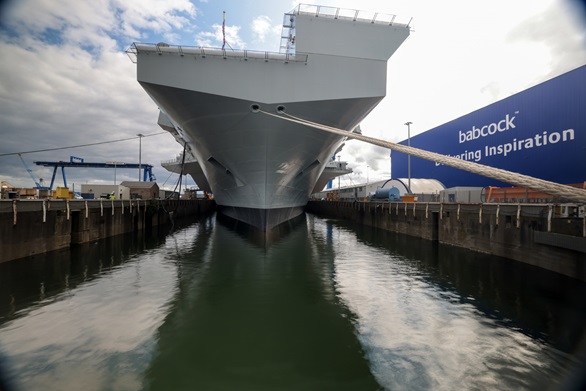 HMS Prince of Wales sits in the water again in dry dock in Rosyth