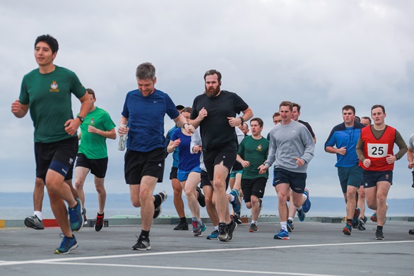 HMS Queen Elizabeth's ship's company complete a Parkrun on board for the first time. Picture: LPhot May