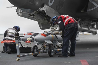 F-35B Lightning jet on HMS Queen Elizabeth being loaded with live ammunition for training drills. Picture: LPhot Belinda Alker