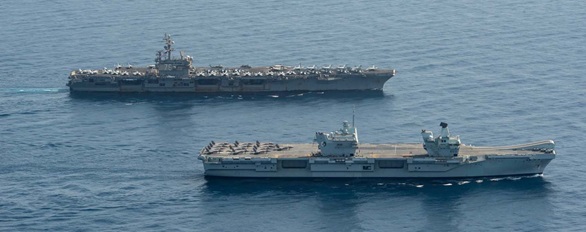 HMS Queen Elizabeth meets up with the USS Ronald Reagan carrier strike group and USS Iwo Jima amphibious ready group for training in the Gulf of Aden. Picture: Seaman Gray Gibson/US Navy